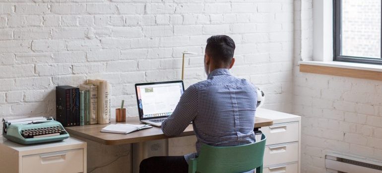 male in the office space, working