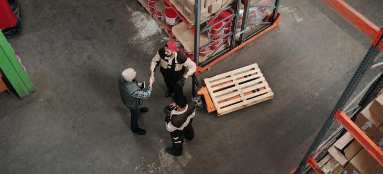 Two persons shaking hands.