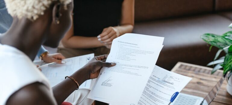 Understanding moving documents and paperwork - a woman reading a document