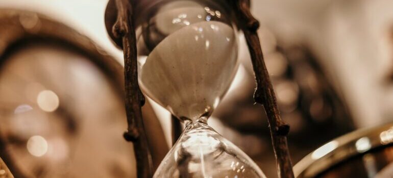 Hourglass zoomed in, sand is showing that time is passing while moving from Maryland to Virginia on short notice 