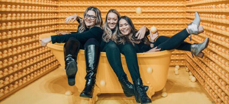 three people in a bathtub