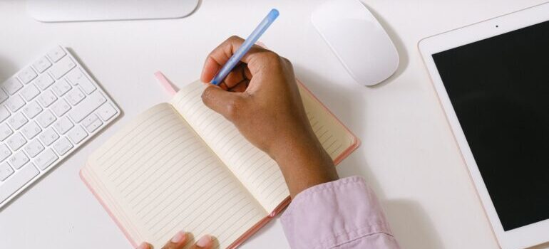 Woman making a plan in her notebook.