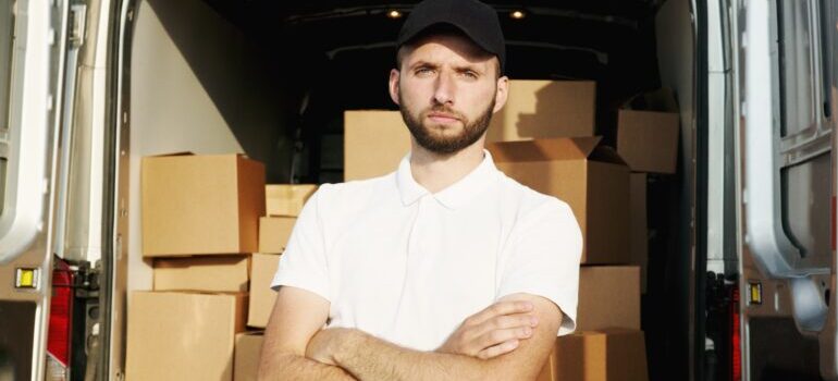 Man standing in front of a truck.