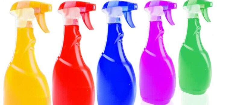 Five bottles of cleaning supplies in spray 