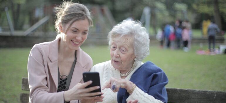 Senior talking to a young woman