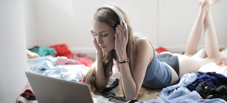 Woman listening to music in clutter