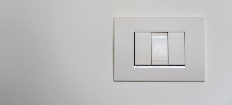 White light switch on a white wall