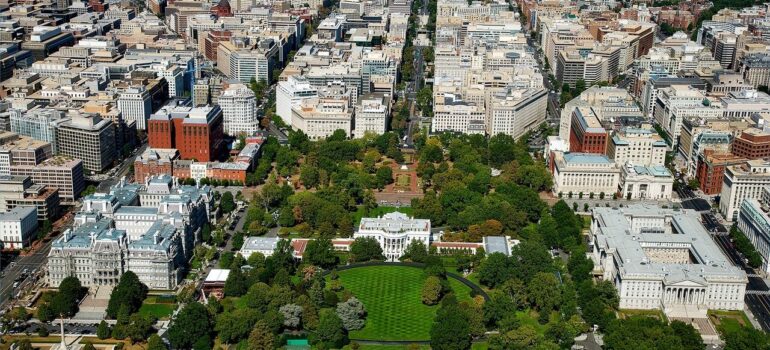 an aerial view of the city of Washington with the White House at its center