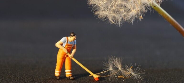 Figure of a man cleaning 