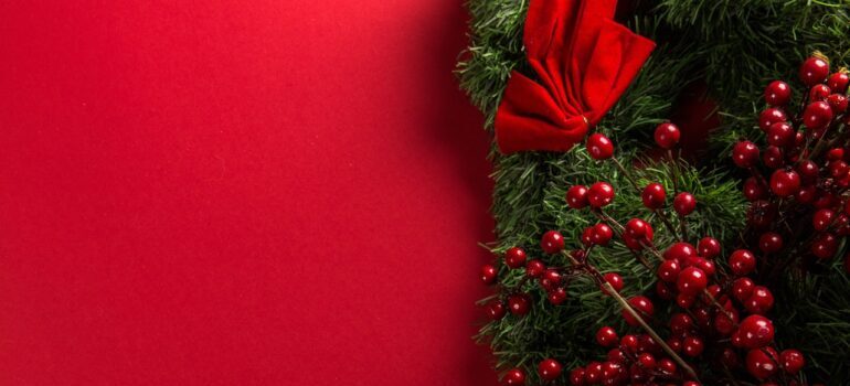 Christmas wreath on a red surface 