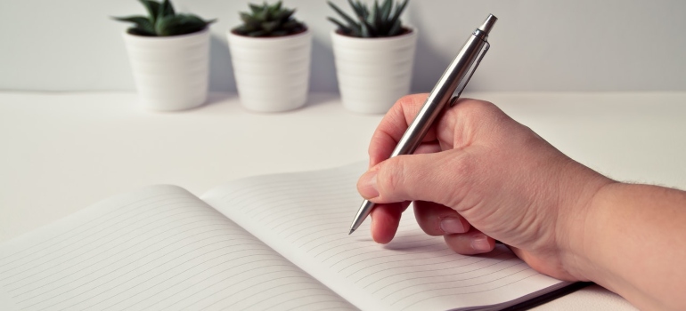 A woman writing in a notebook