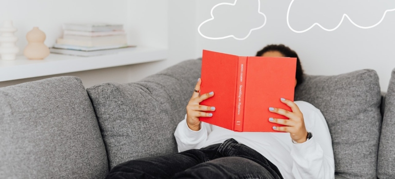 A woman reading on a couch