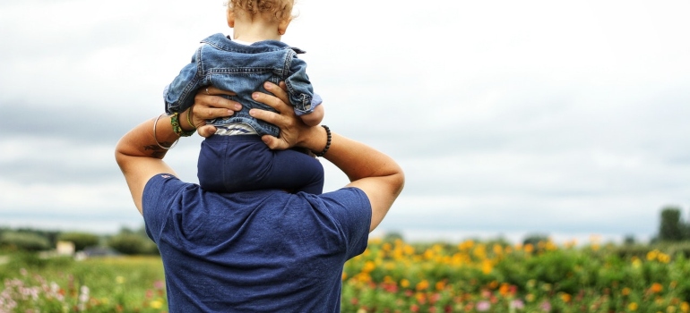 Person holding a kid 