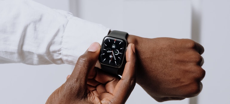 A man checking the time on his wristwatch 