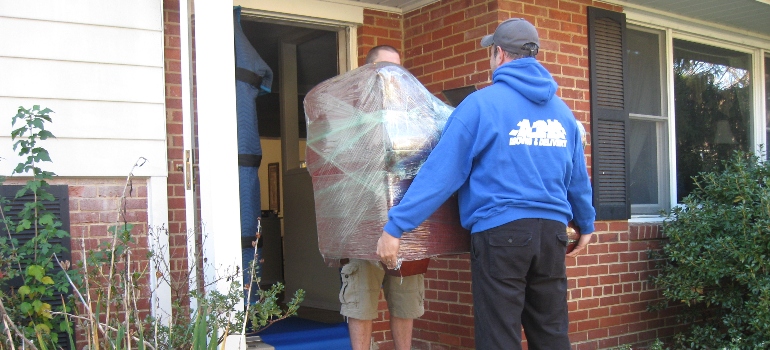 Movers carrying an item