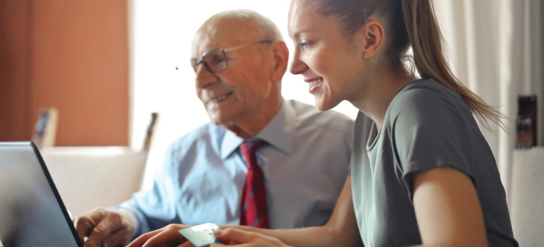 Senior talking to a young woman about the best places in Virginia to spend your golden years