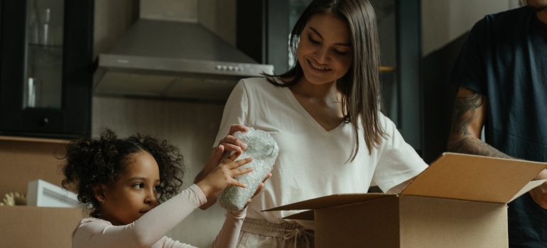 A happy family packing for the move