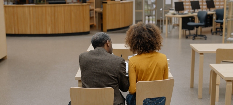 A professor helping a student