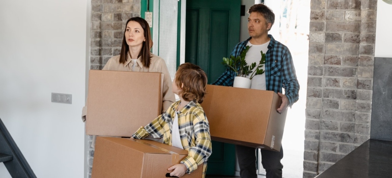 Parents allowing their child to help out during the move