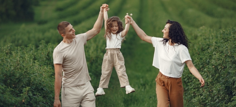 Parents playing with their child