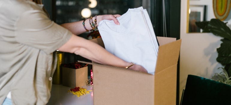 A woman packing T-shirts