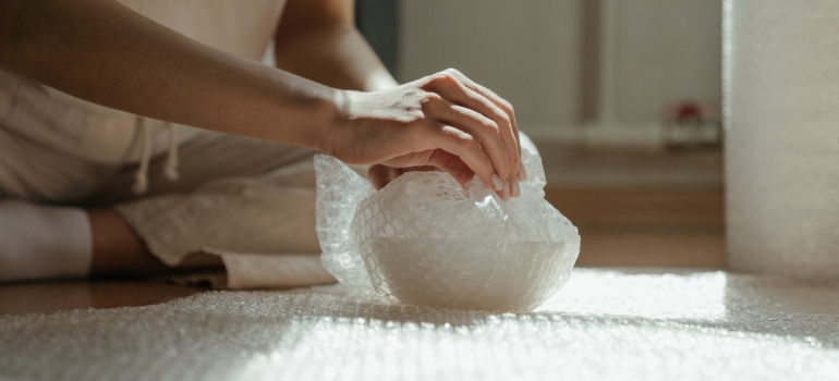 Picture of a person packing breakables for relocation