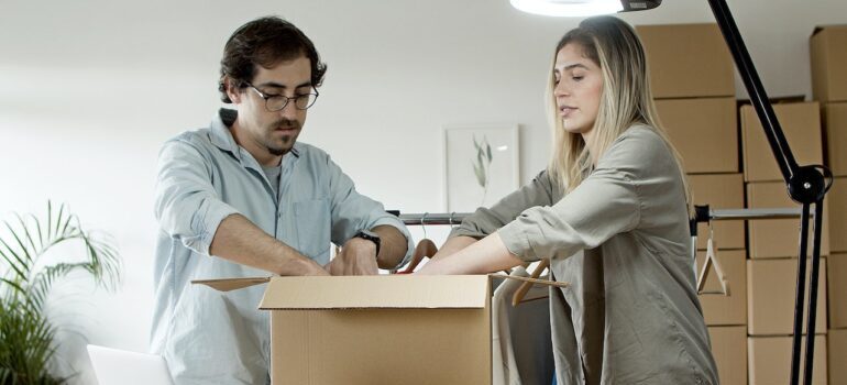 Man and woman packing boxes 