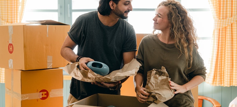 A couple packing their belongings