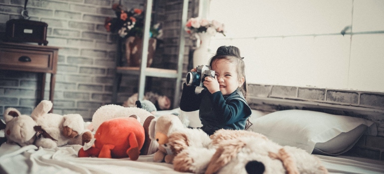 Girl playing with a camera 