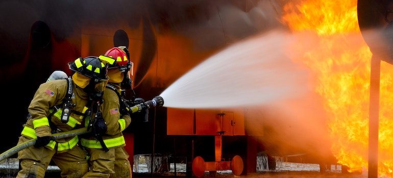 Firemen Blowing Water on Fire