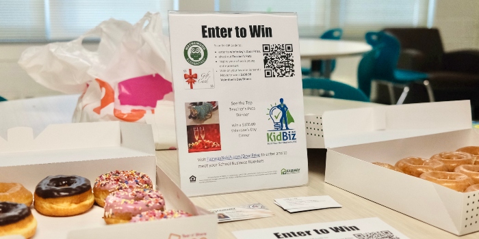a table with donuts and a manual on entering a prize competition