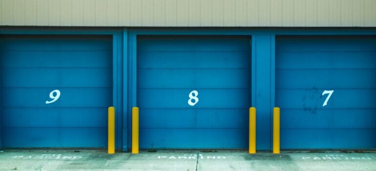 Storage units with blue doors and numbers