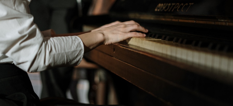 Picture of a person playing a piano 