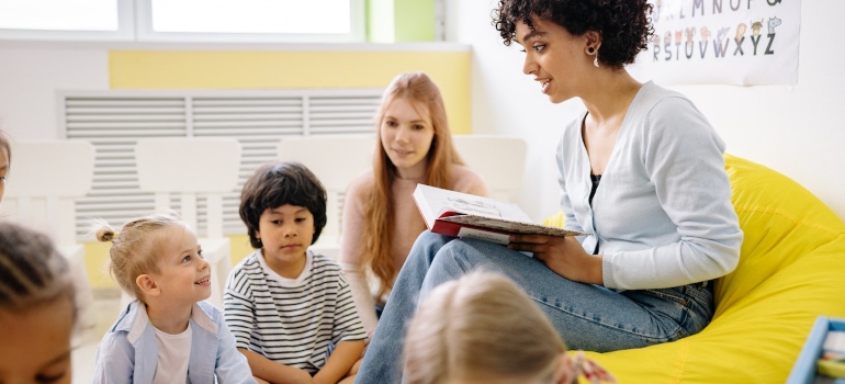 Picture of a teacher and kids 