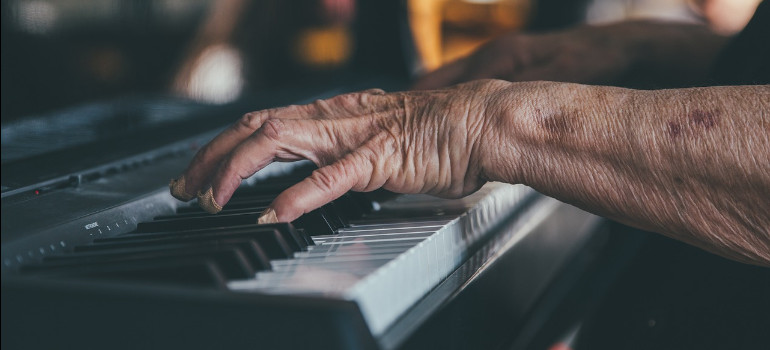 Hands playing a piano they know hands