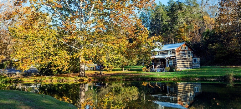 Log cabin near pond lake.