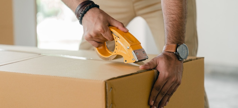 a man packing boxes for self storage Alexandria VA