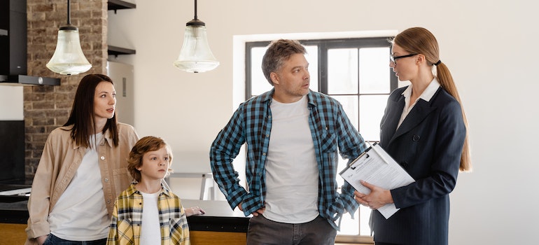 Man talking with movers about what not to do when moving a piano