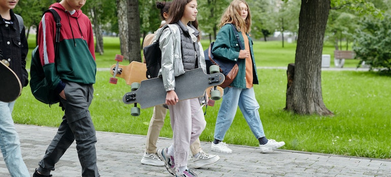 A Girl Holding a Longboard