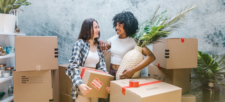 Two women surrounded by boxes