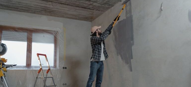 a guy painting walls