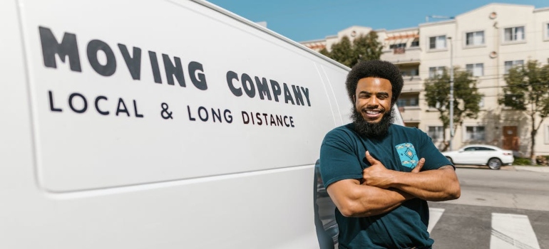 a movers next to a moving van