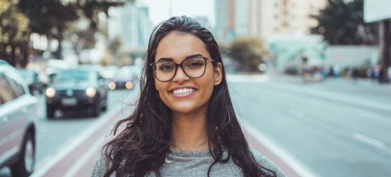 A girl in the city posing for a camera