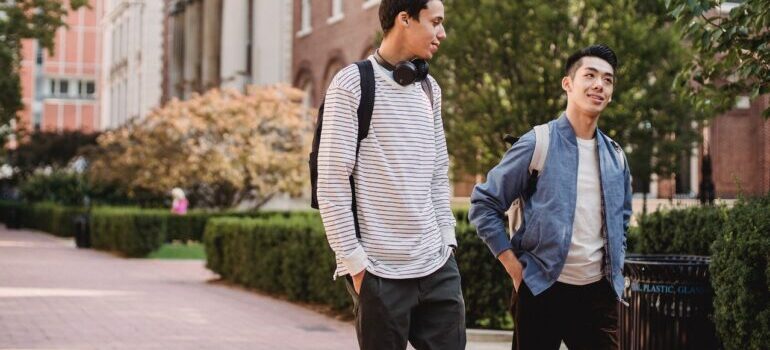 Two students walking through the campus