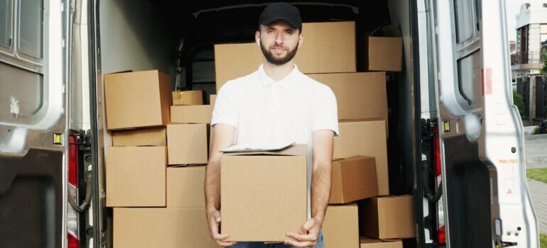 A mover in front of a moving van