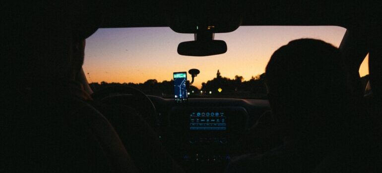 People in the car learning about places to visit after moving to VA