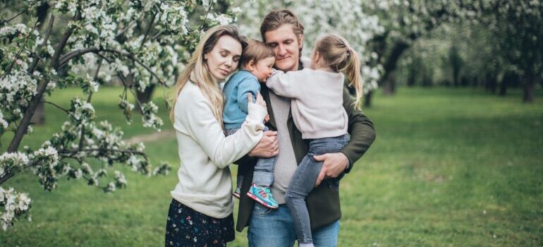 Family hugging in the nature