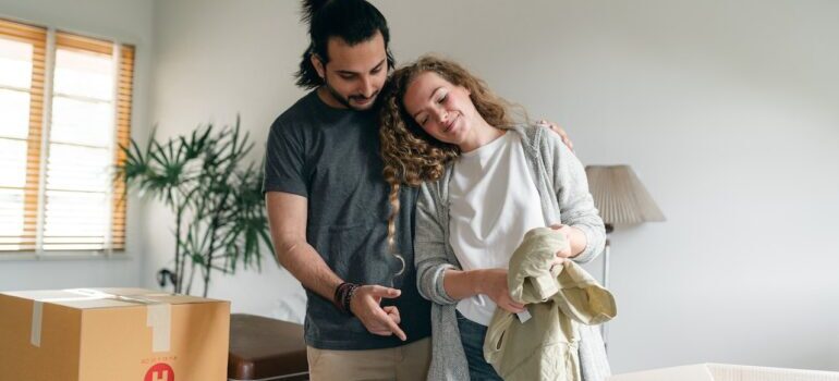 A couple having a nice time while packing