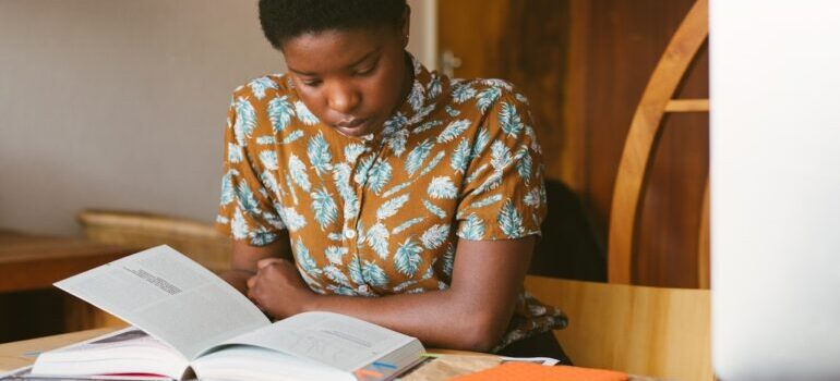 A student learning from the book