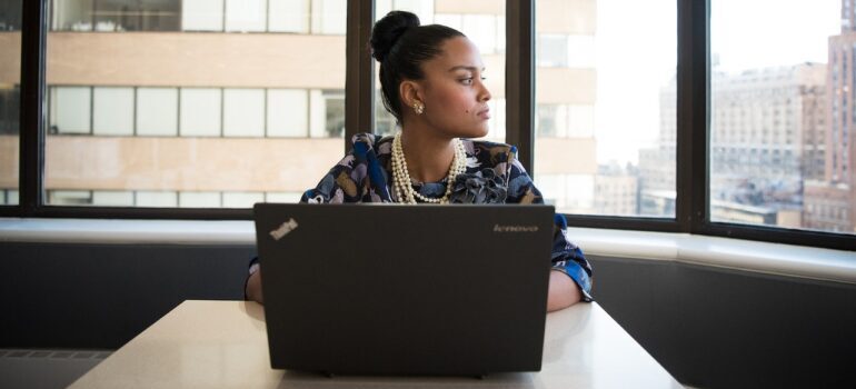 A woman in the office thinking